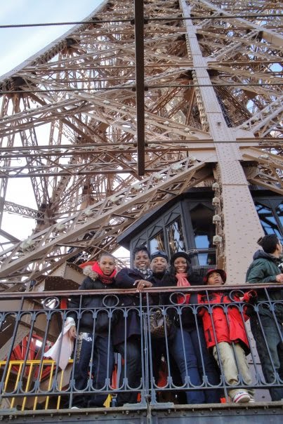Atop Paris' Eiffel Tower at Christmas with family
