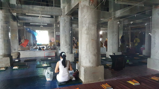 inside praying woman Big Buddha, Phuket Thailand, Buddhist