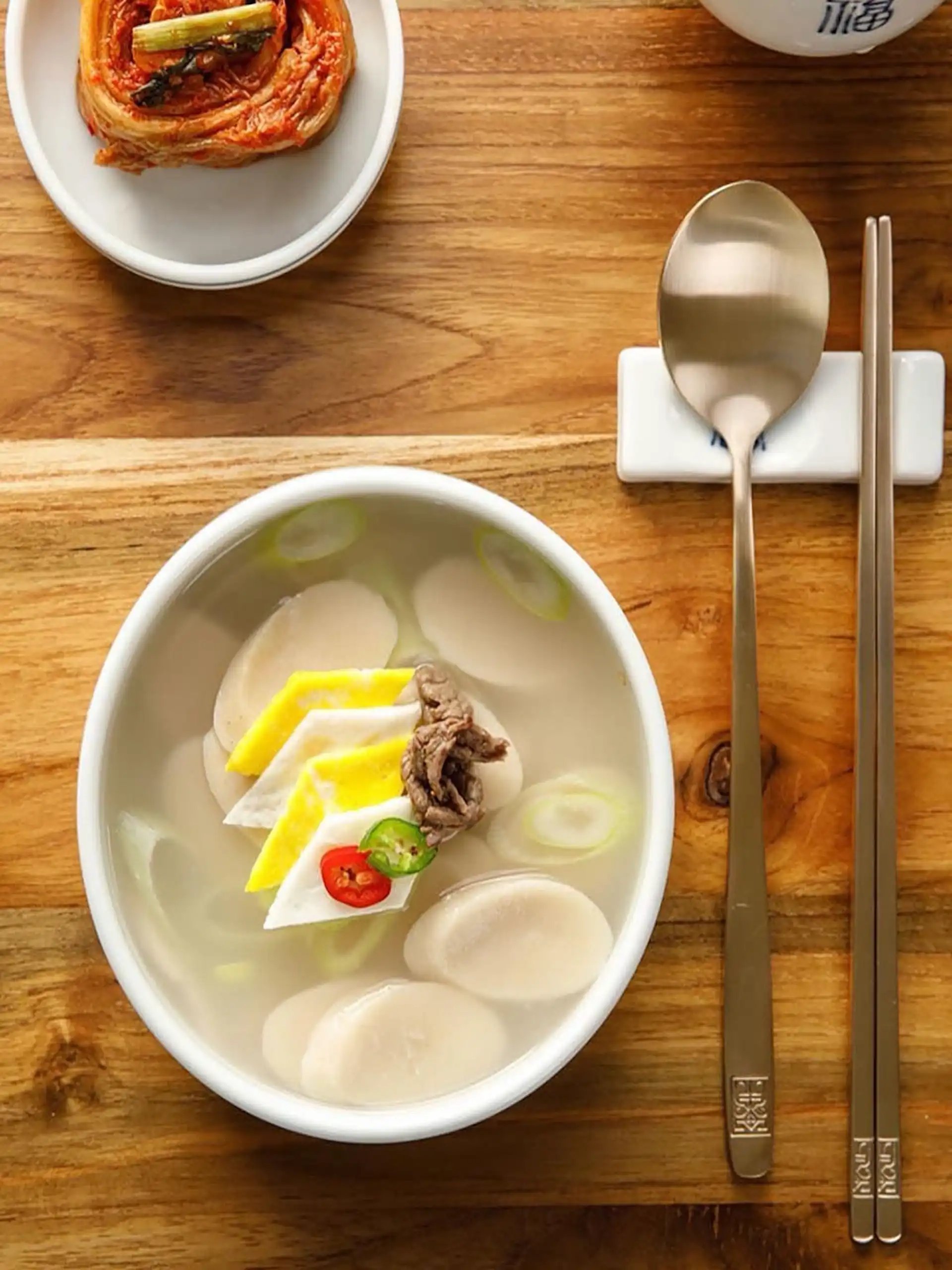 Korean New Year celebration with tteokguk table