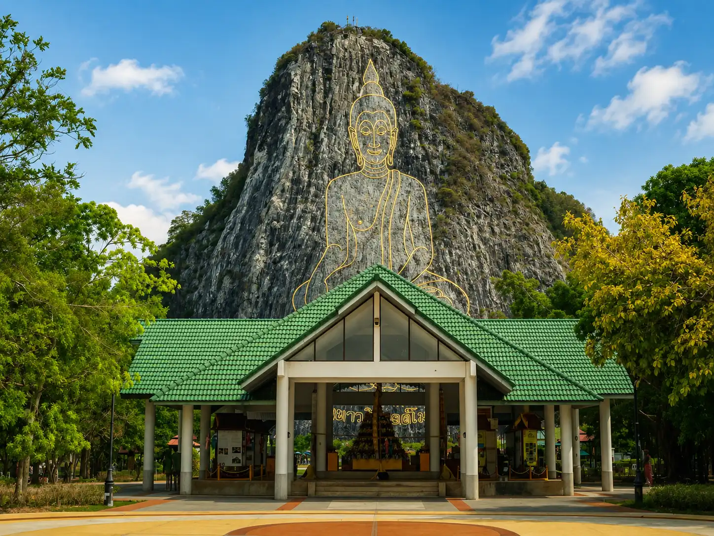Temple Pavilion Beneath Golden Cliff Buddha
