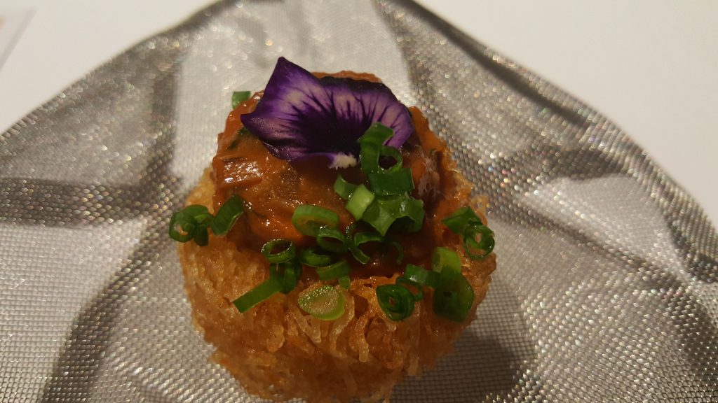 The potato cake with curry and edible flowers were magnificently plated. It is just one of the 18 course plates served on the progressive Indian menu that is always changing based on seasonal frats and vegetables. The dinner costs 4,000 Baht per person.