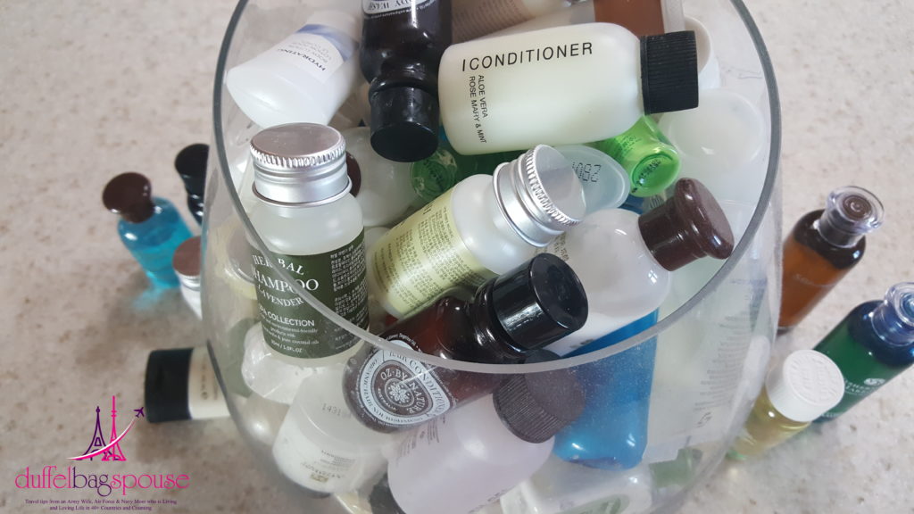 26 Signs You are Addicted to Travel- bucket of shampoos, conditions, soaps and lotions from our travels