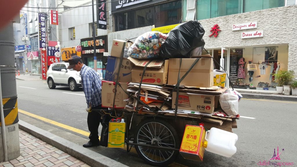 Elderly Korean collecting trash