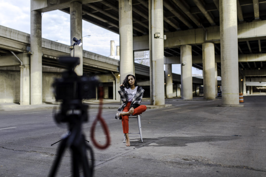 black-girl-and-camera-under-a-bridge-1024x683 Why More People of Color Should Blog About Travel
