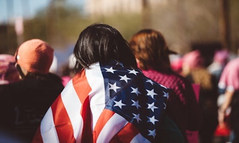 woman draped in an American flag