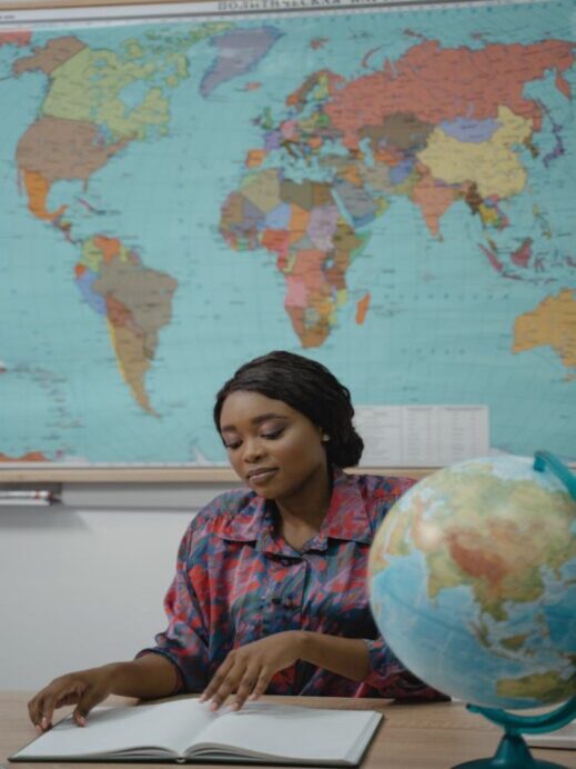 DNA plan future travel- black woman with globe