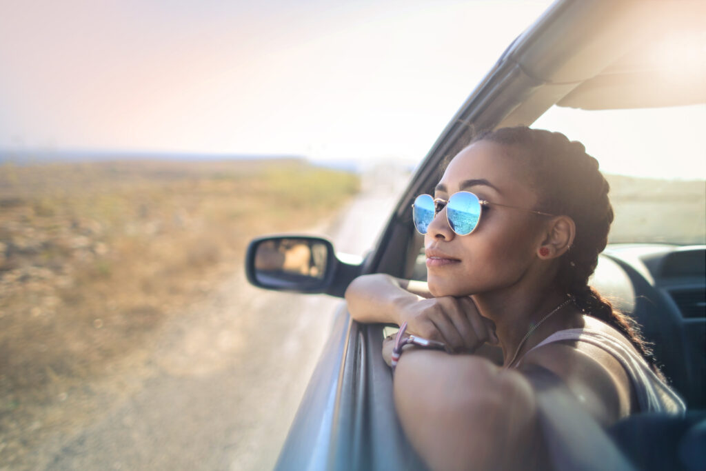 duffelbagspouse daydreaming about travel in out car window