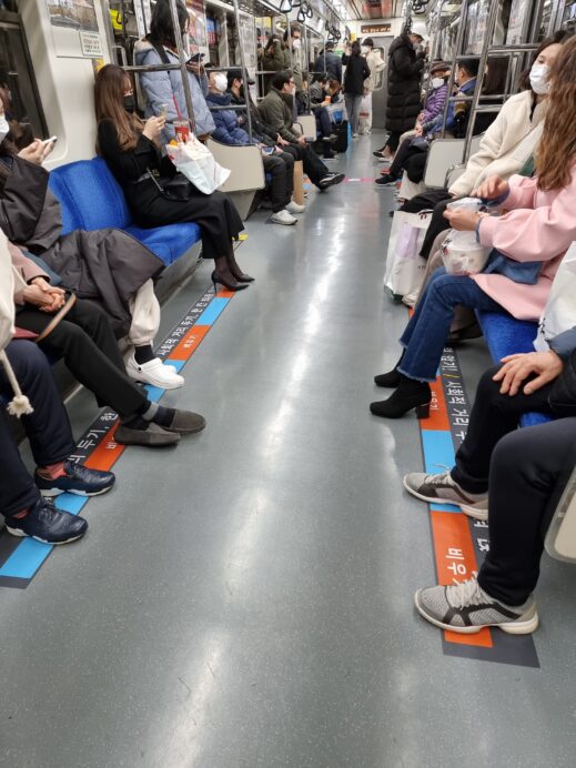 Social distance markers inside the car of the Daegu Metro (subway)