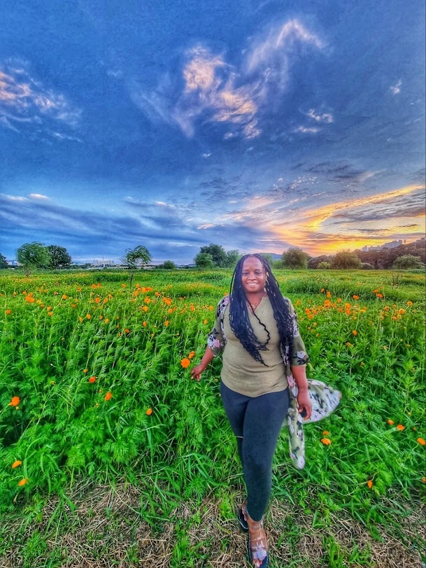 Military spouse sunset in field
