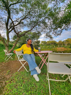Military spouse yellow sweater seated