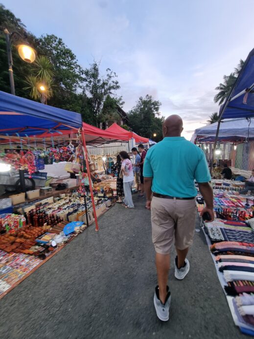 Steven-souvenir-shopping-in-Luang-Prabang-scaled