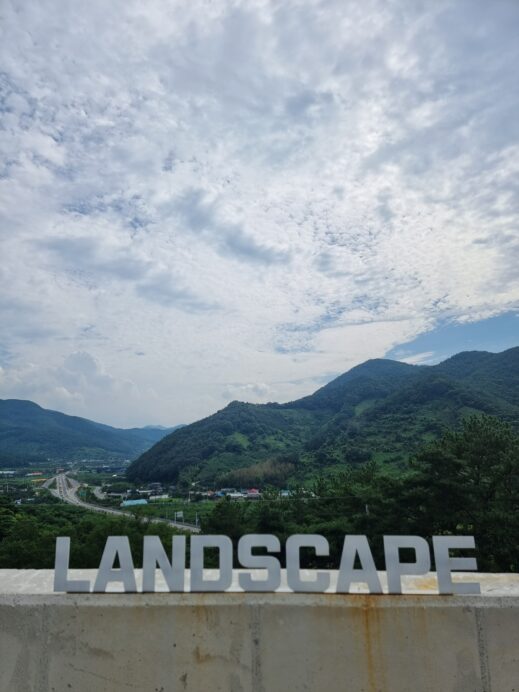 Peak Pleasures: Unparalleled Views at Landscape Cafe sign