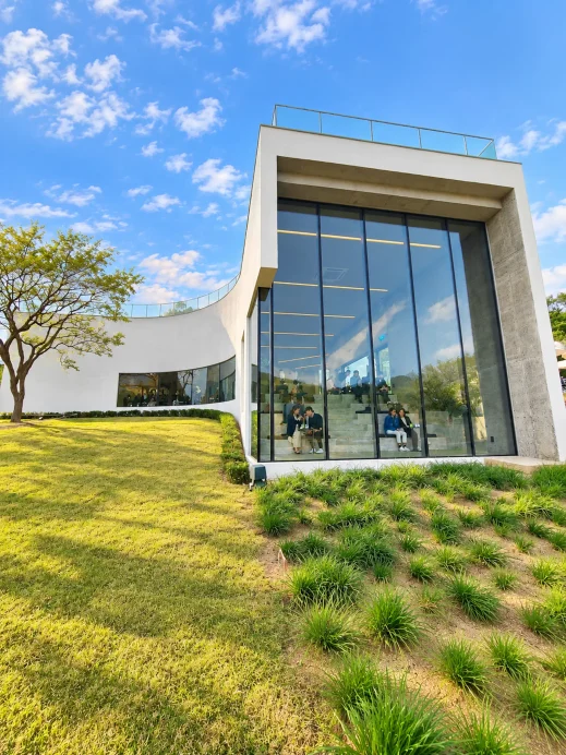 Modern Glass Cafe Beneath Blue Skies
