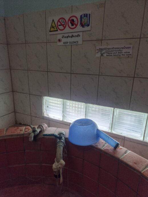 blue bucket on the private bath rim