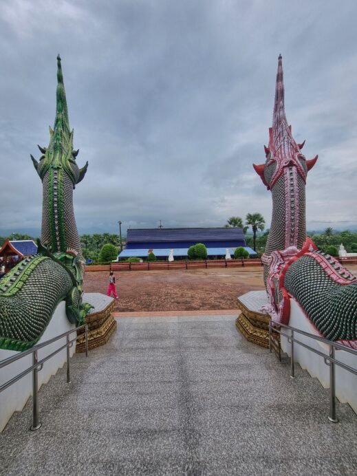 pink and green Naga dragons from inside temple at Wat Ban Den Temple