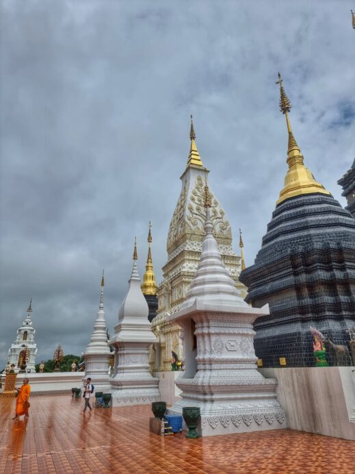 12 stupas with monks at Wat Ban Den Temple