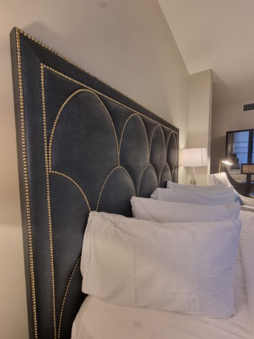 Studded-headboard art deco at Hotel Saint Louis