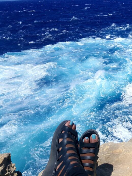 Blue toe polish over the Malta sea