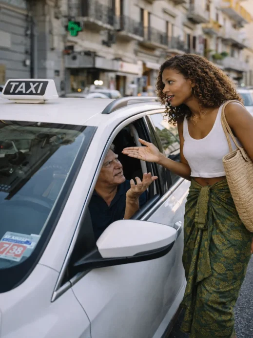 black girl catching an Italian taxi