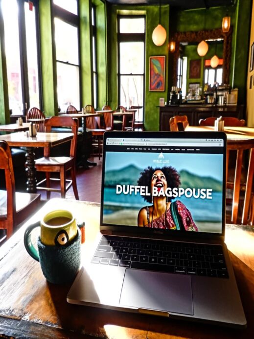 duffelbagspouse laptop in a coffee shop