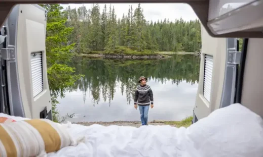 Van life bed at lake