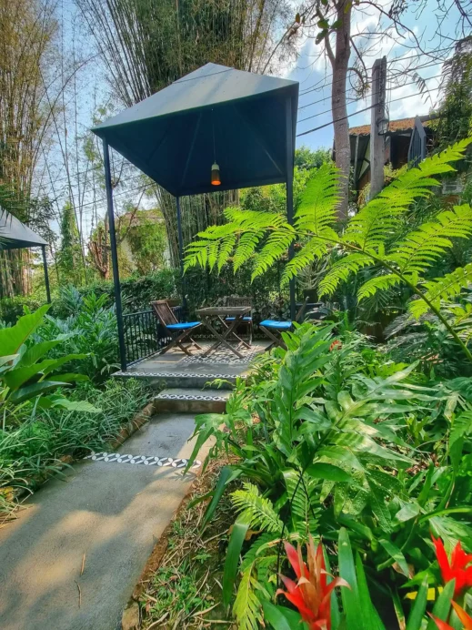 outdoor seating flowers walkway Fleur Cafe in Chiang Mai