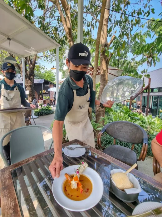 serving food at Fleur Cafe & Eatery