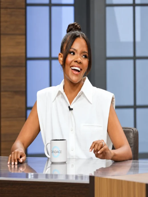 Candace Owens in white at studio desk