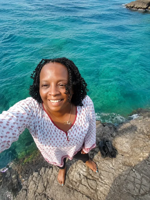Sicily, Stacey, barefoot, rocky beach