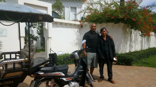 Steven and Tuk tuk driver in Cambodia