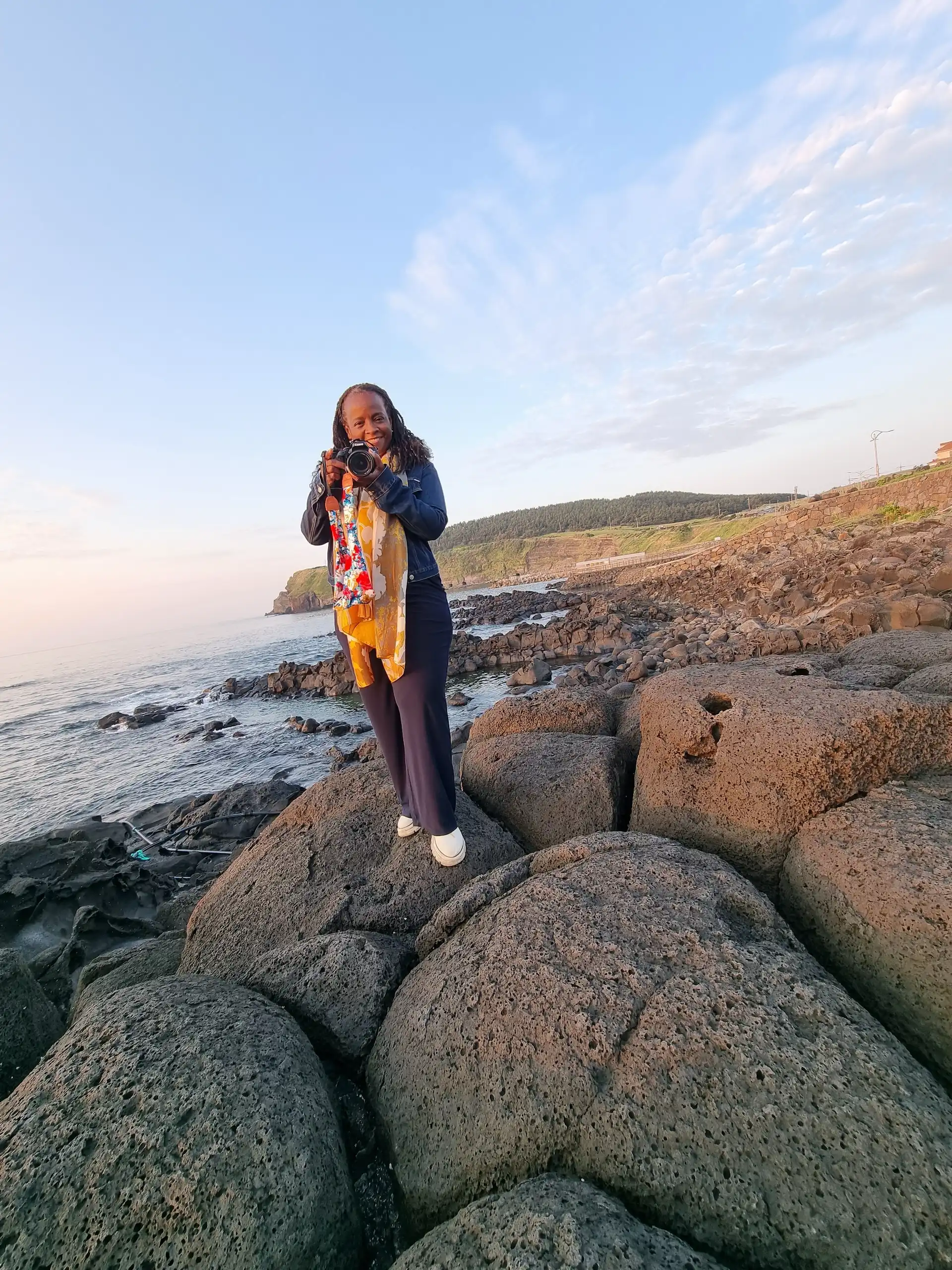 Stacey, rocks, camera, Jeju South Korea