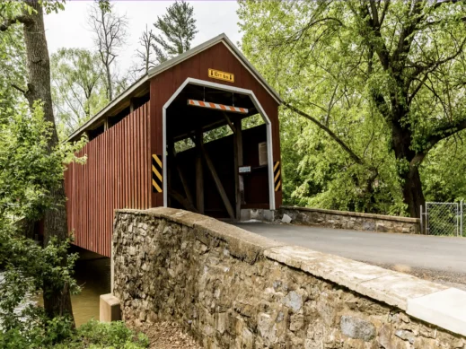 Madison County Covered Bridge and brick wall, prettiest towns in Iowa