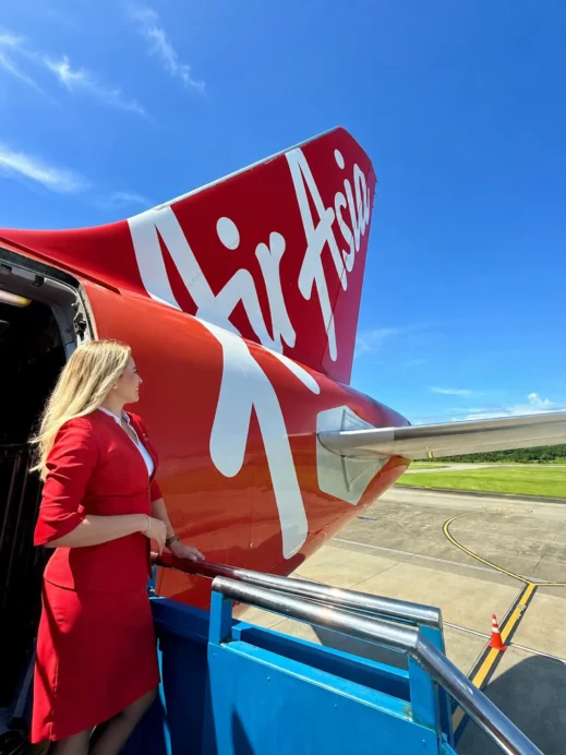 Air Asia, flight attendant, top of the stairs