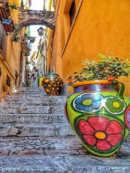 Taormina, alley steps, colorful vase