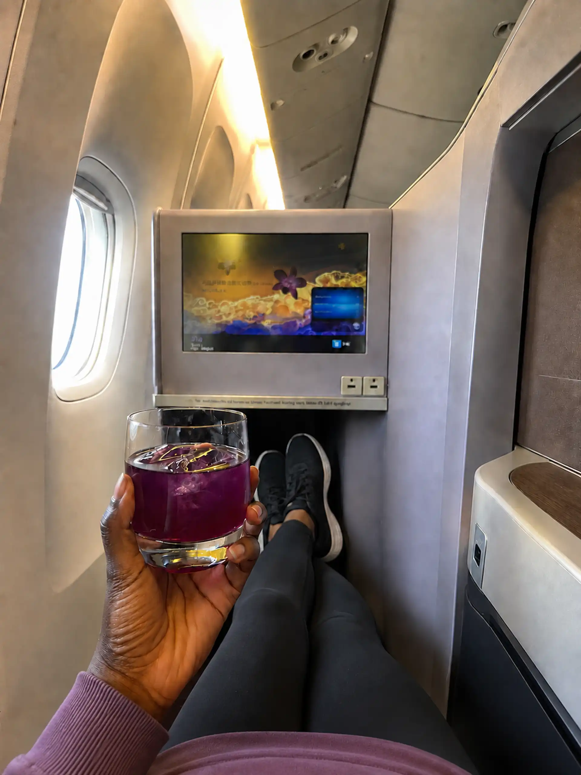 Thai Airlines, seat upgrade, holding welcome drink