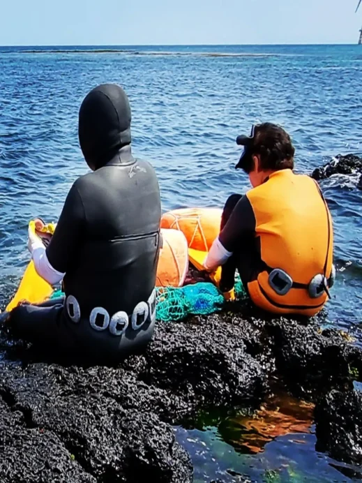 Jeju Photo Haenyo ladies sitting on coral
