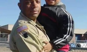 Steven-with-kid-Malik deployment school